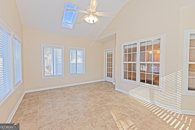 unfurnished sunroom with vaulted ceiling with skylight and ceiling fan