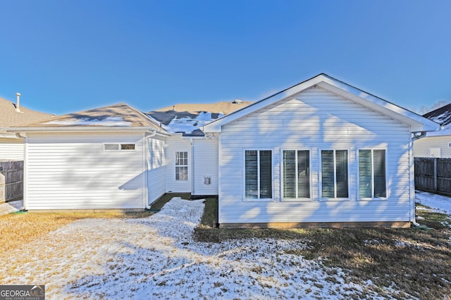 view of snow covered house