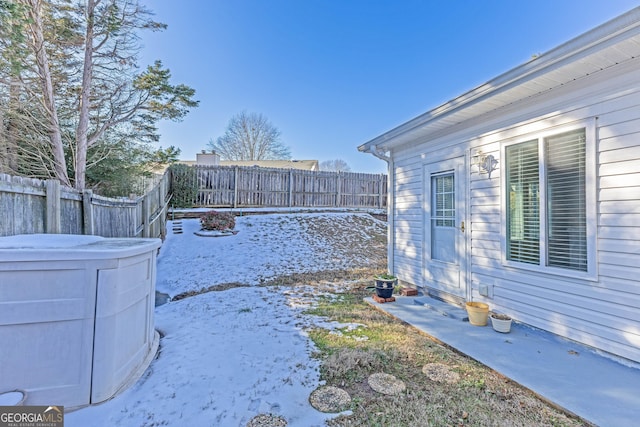 view of yard layered in snow