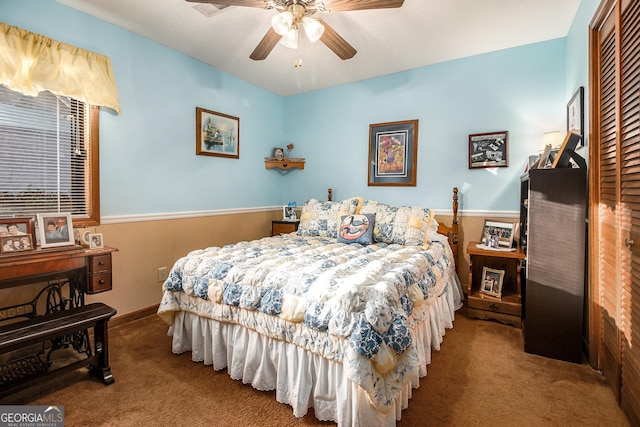 carpeted bedroom with a closet and ceiling fan