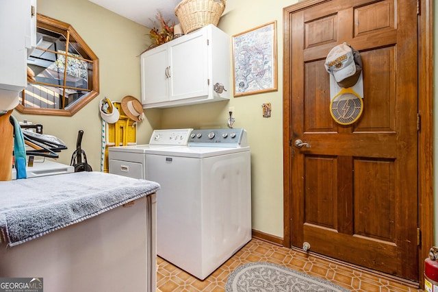 laundry area featuring independent washer and dryer, cabinets, and light tile patterned floors