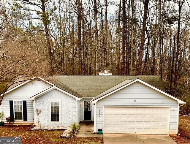 single story home featuring a garage