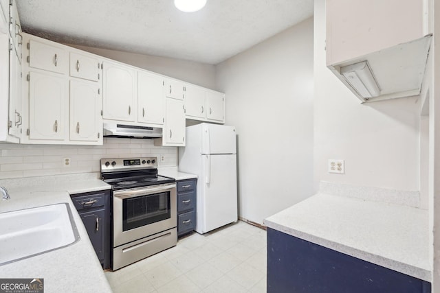 kitchen featuring white cabinets, lofted ceiling, white fridge, sink, and stainless steel range with electric stovetop