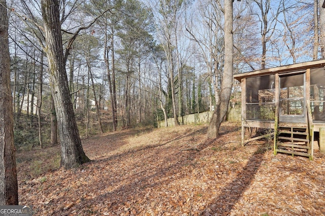 view of yard featuring a sunroom