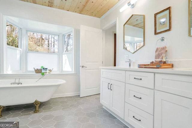 bathroom featuring vanity, wood ceiling, and a tub