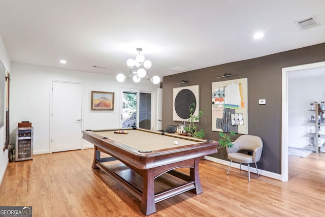 playroom with wine cooler, billiards, and light hardwood / wood-style flooring