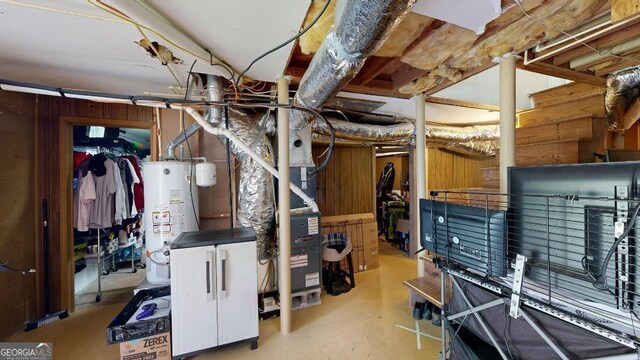 basement with gas water heater and heating unit