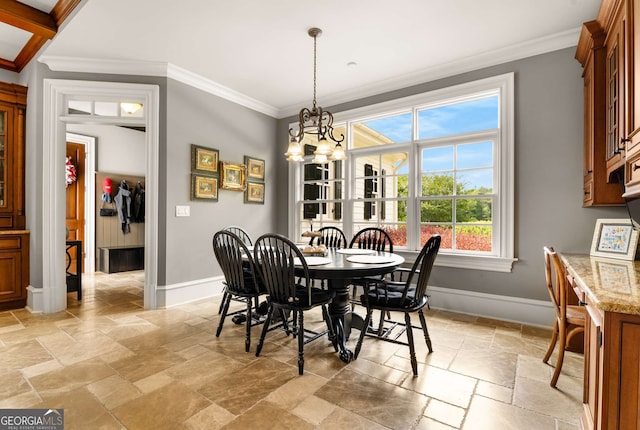 dining area featuring an inviting chandelier and crown molding