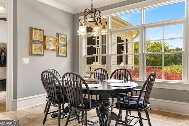 dining room featuring crown molding and a notable chandelier