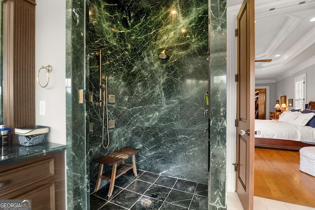 bathroom featuring vanity, crown molding, and a shower with shower door