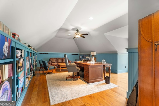 office space featuring hardwood / wood-style flooring, ceiling fan, and lofted ceiling