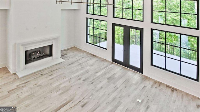 unfurnished living room featuring light wood-type flooring