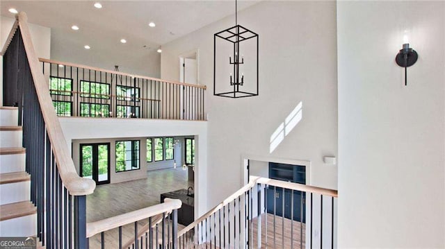 staircase with a towering ceiling