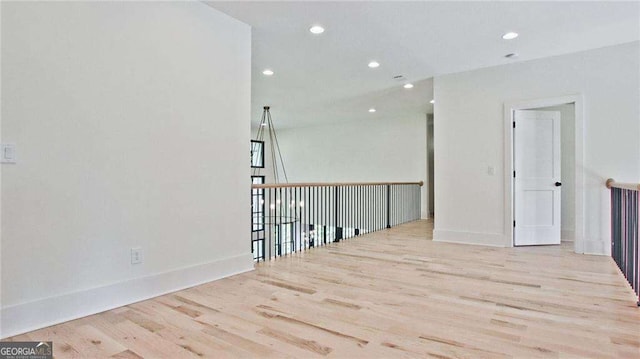 spare room featuring light wood-type flooring