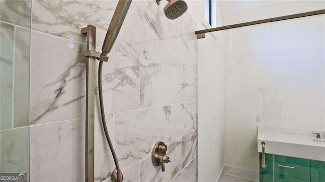 bathroom with tiled shower