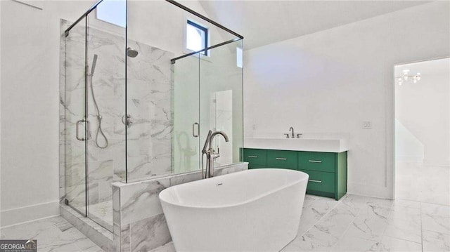 bathroom featuring an inviting chandelier, vaulted ceiling, vanity, and shower with separate bathtub