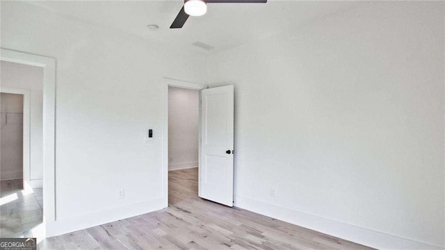 unfurnished bedroom featuring ceiling fan and light wood-type flooring