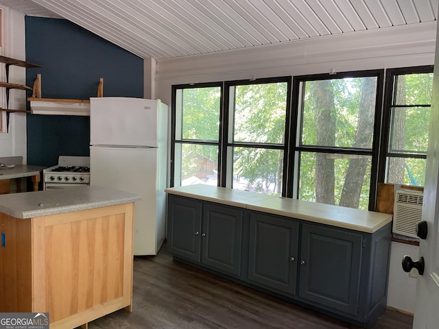 kitchen with white appliances, vaulted ceiling, gray cabinetry, dark wood-type flooring, and cooling unit