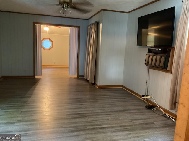 interior space featuring ceiling fan, ornamental molding, and wood-type flooring