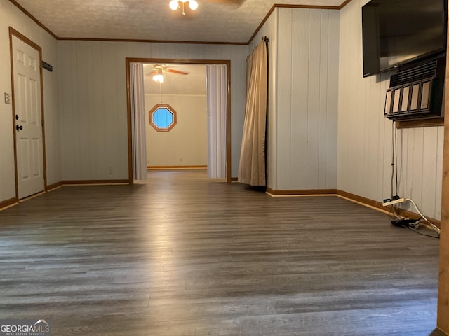 interior space featuring a textured ceiling, ceiling fan, crown molding, and hardwood / wood-style flooring