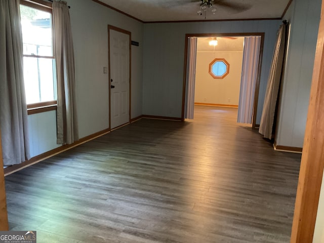 interior space with ceiling fan, ornamental molding, and hardwood / wood-style flooring