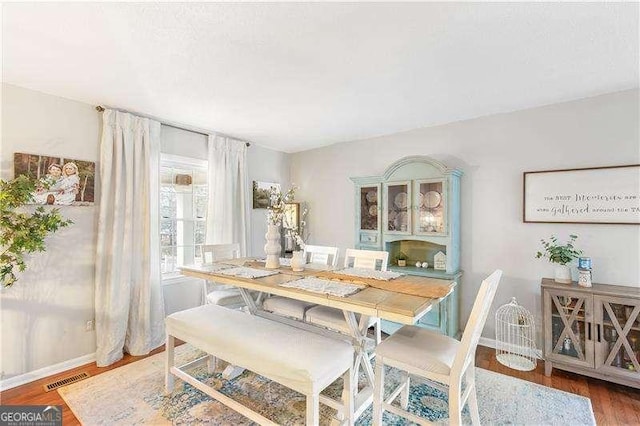 dining room with hardwood / wood-style floors