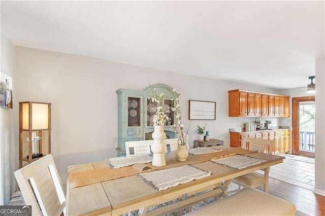 dining area featuring ceiling fan and hardwood / wood-style floors