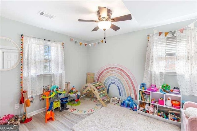 playroom featuring ceiling fan and wood-type flooring