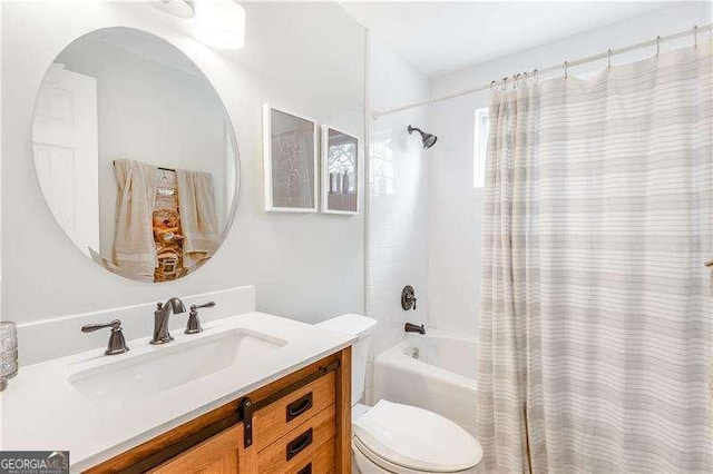 full bathroom with shower / bath combination with curtain, vanity, and toilet