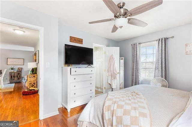 bedroom featuring ceiling fan and hardwood / wood-style flooring