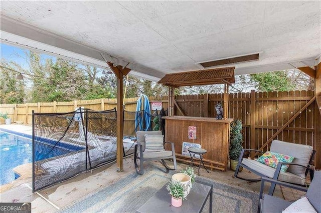 view of patio / terrace featuring a fenced in pool