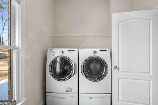 washroom featuring washing machine and dryer