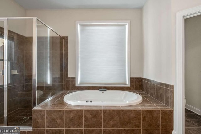 bathroom featuring shower with separate bathtub, tile patterned flooring, and plenty of natural light