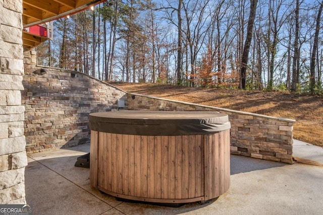 view of patio with a hot tub