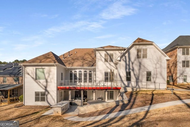 back of property featuring a patio area