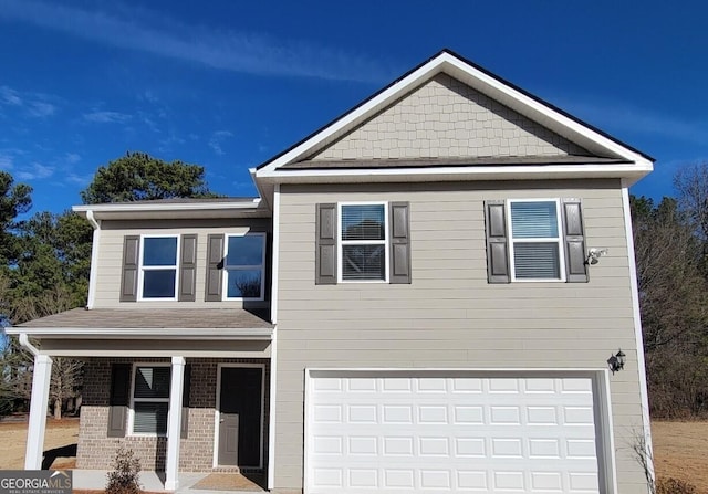 view of front of home with a garage and a porch