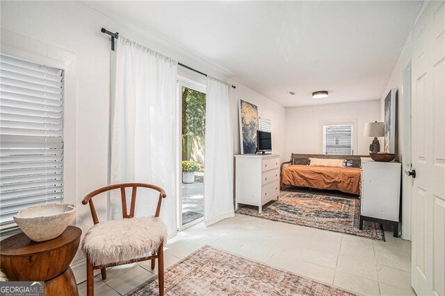 laundry room featuring gas water heater, washing machine and clothes dryer, and cabinets