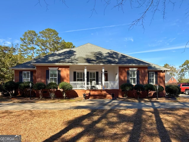 ranch-style home featuring covered porch