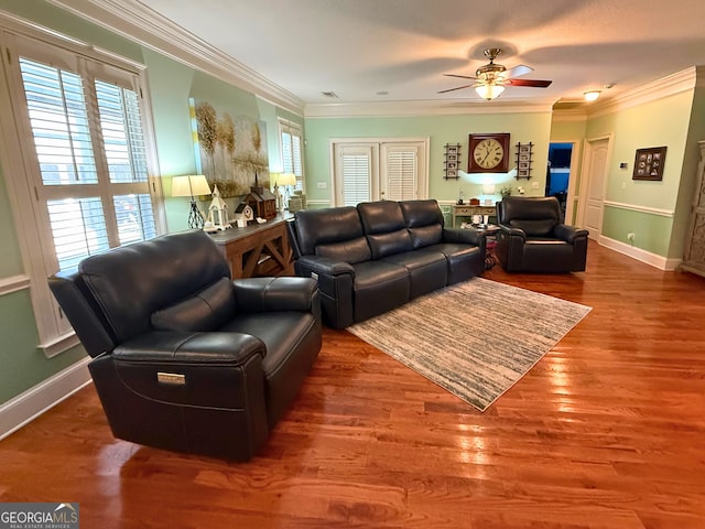 living room with ceiling fan, hardwood / wood-style flooring, and ornamental molding