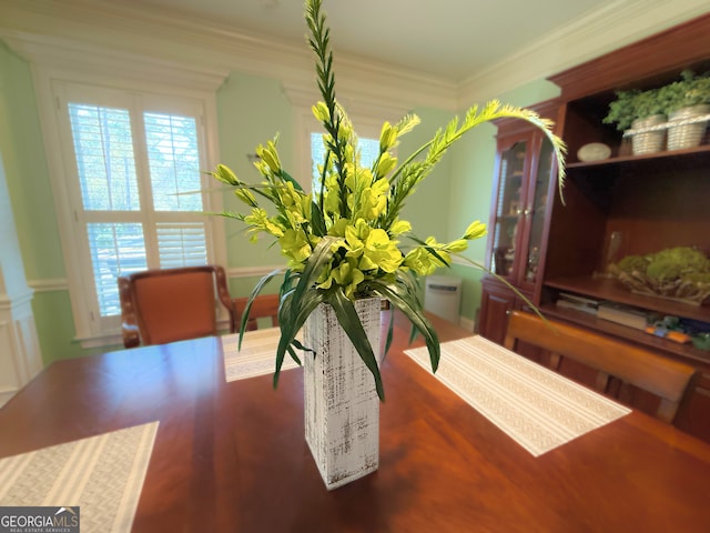 dining space featuring ornamental molding