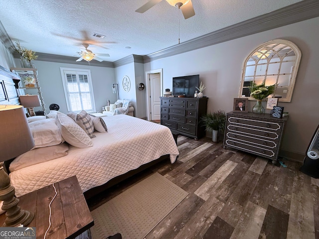 bedroom featuring dark hardwood / wood-style flooring, a textured ceiling, ceiling fan, and ornamental molding