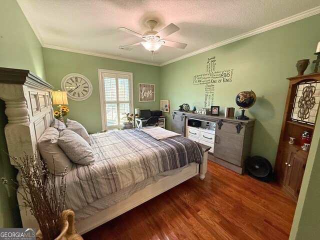 bedroom featuring ceiling fan, crown molding, a textured ceiling, and hardwood / wood-style flooring