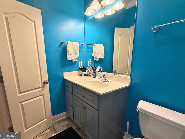 bathroom featuring toilet and vanity