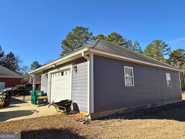 view of property exterior with a garage