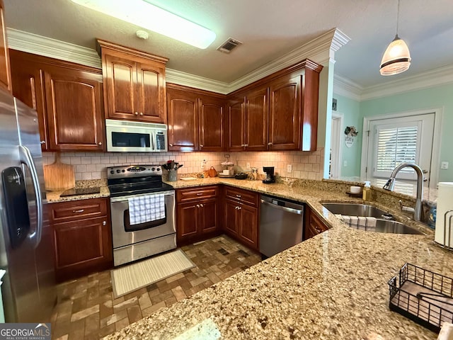 kitchen featuring hanging light fixtures, decorative backsplash, crown molding, appliances with stainless steel finishes, and sink