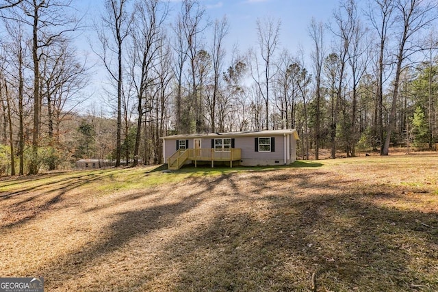 view of front of home featuring crawl space, a front lawn, and a deck