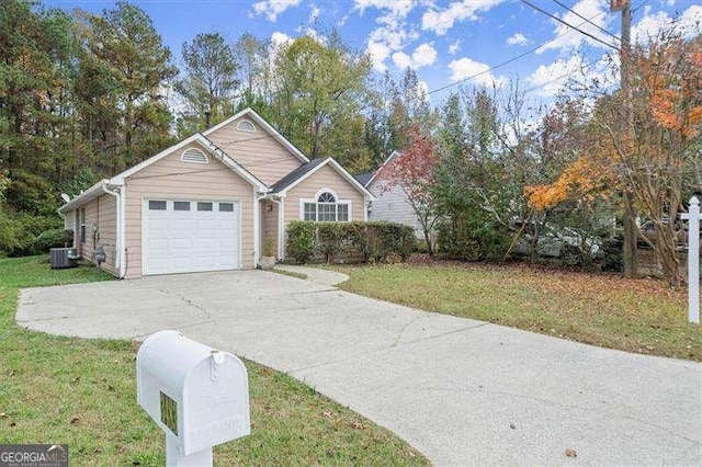 view of front of house with cooling unit, a front lawn, and a garage