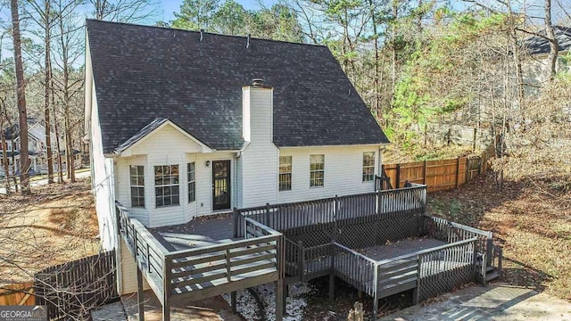 rear view of house featuring a deck