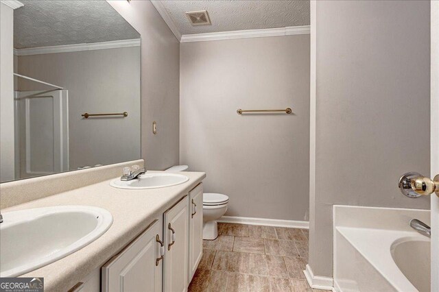 bathroom with a washtub, tile patterned flooring, crown molding, vanity, and a textured ceiling