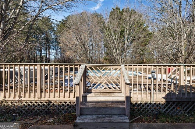 view of pool with a wooden deck